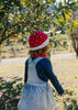 Strawberry Beanie – kids hand-knitted beanie with strawberry, flower, and leaf design in soft wool blend shown on child - back view – Acorn Kids