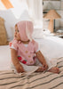 Bunny Beanie Pink – baby and toddler cotton beanie with floppy bunny ears and tie straps on baby side view – Acorn Kids