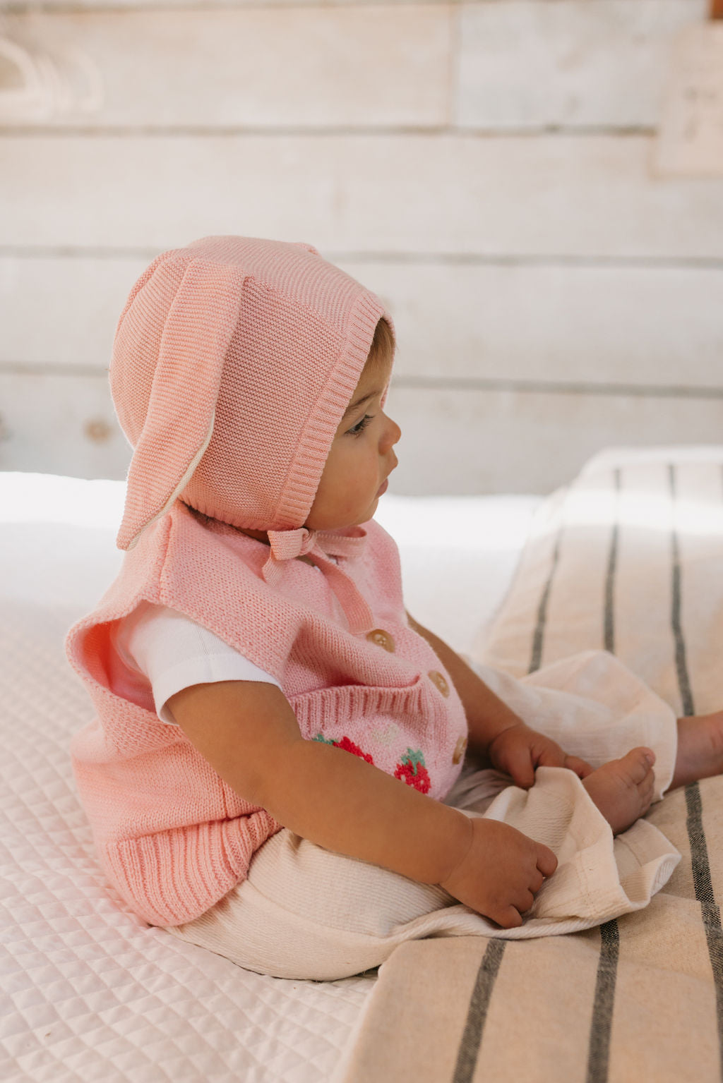 Bunny Beanie Pink – baby and toddler cotton beanie with floppy bunny ears and tie straps on baby side view – Acorn Kids