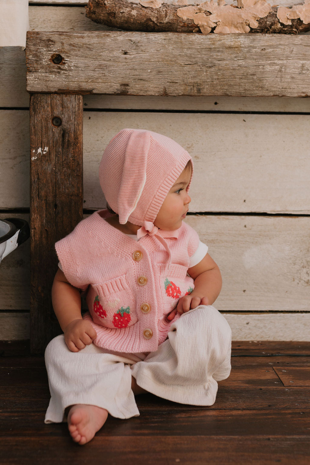 Bunny Beanie Pink – baby and toddler cotton beanie with floppy bunny ears and tie straps on baby side view – Acorn Kids