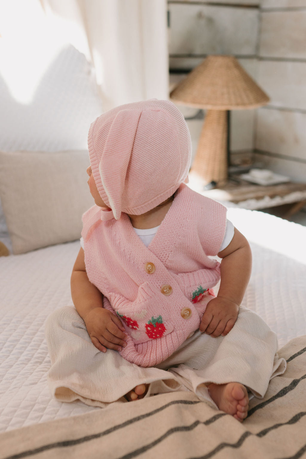 Bunny Beanie Pink – baby and toddler cotton beanie with floppy bunny ears and tie straps on baby side view – Acorn Kids