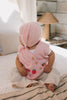 Bunny Beanie Pink – baby and toddler cotton beanie with floppy bunny ears and tie straps on baby side view – Acorn Kids