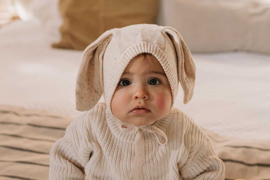 Bunny Beanie Cream – baby and toddler cotton beanie with floppy bunny ears and tie straps on baby front view – Acorn Kids