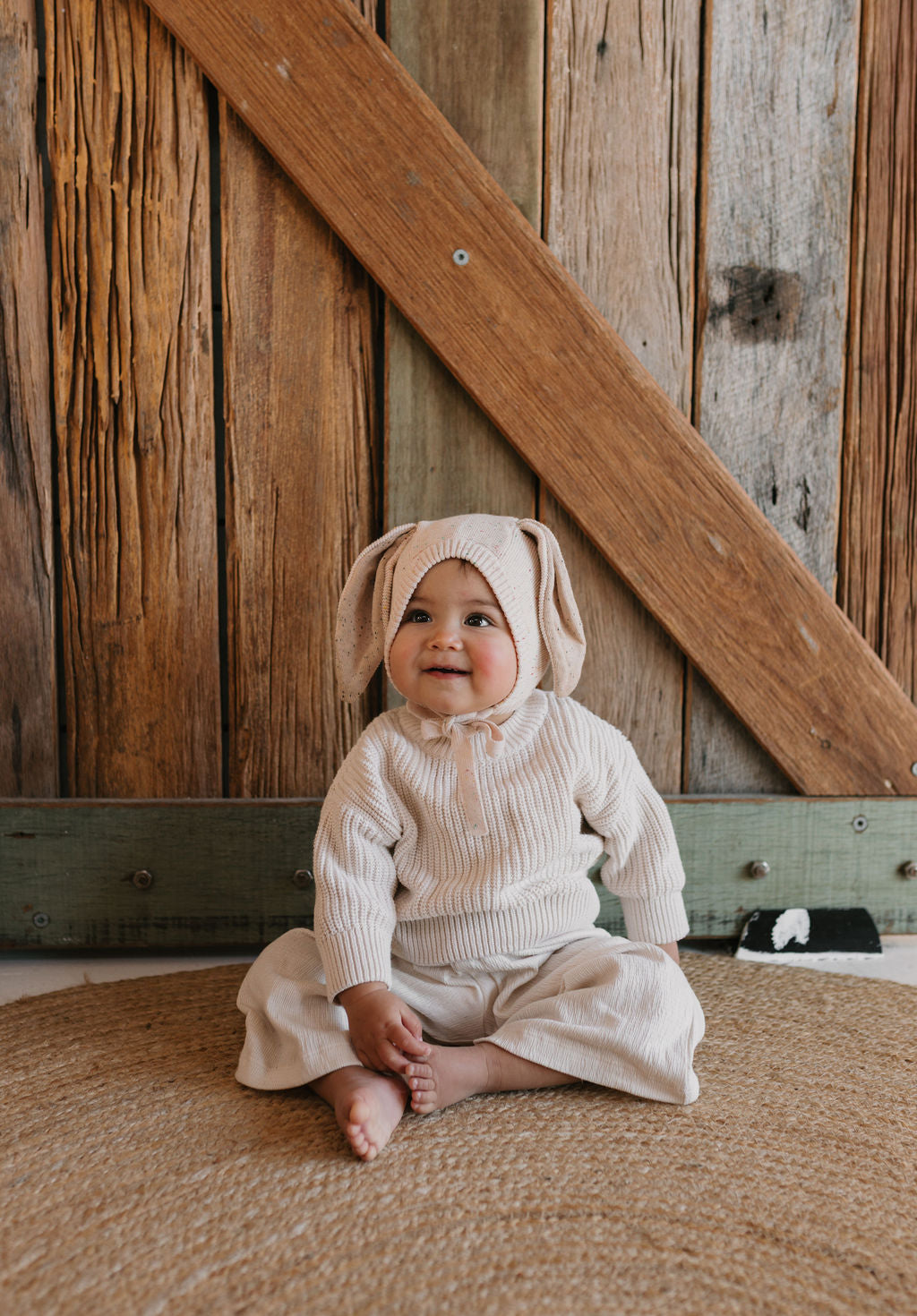 Bunny Beanie Cream – baby and toddler cotton beanie with floppy bunny ears and tie straps on baby front view – Acorn Kids