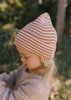 Berlin Merino Beanie Biscuit & Cream Stripe on child side view close up – kids knitted merino wool striped beanie with pointed top – Acorn Kids