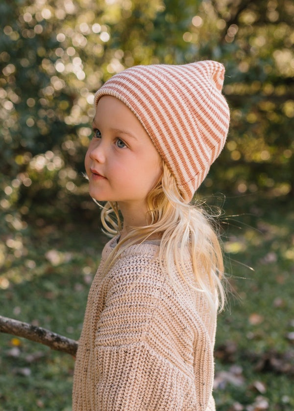 Berlin Merino Beanie Biscuit & Cream Stripe on child side view – kids knitted merino wool striped beanie with pointed top – Acorn Kids