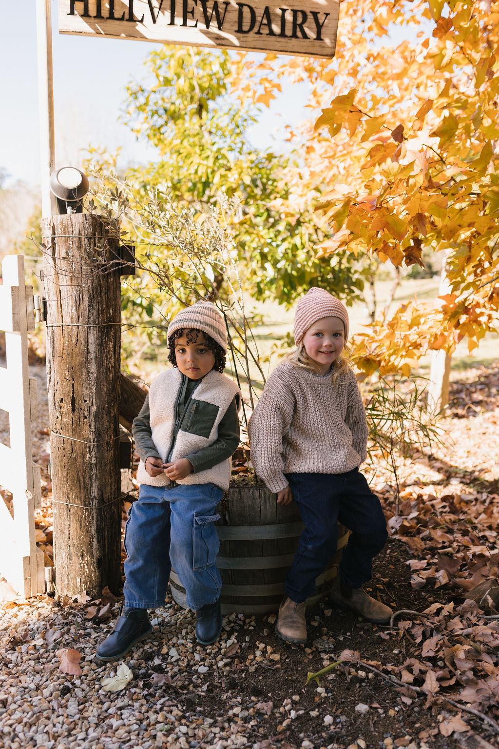 Berlin Merino Beanie Biscuit & Cream Stripe on child front view – kids knitted merino wool striped beanie with pointed top – Acorn Kids