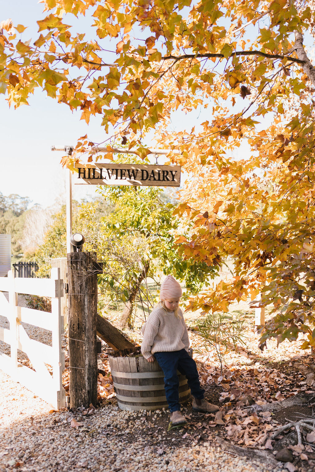 Berlin Merino Beanie Biscuit & Cream Stripe on child front view – kids knitted merino wool striped beanie with pointed top – Acorn Kids