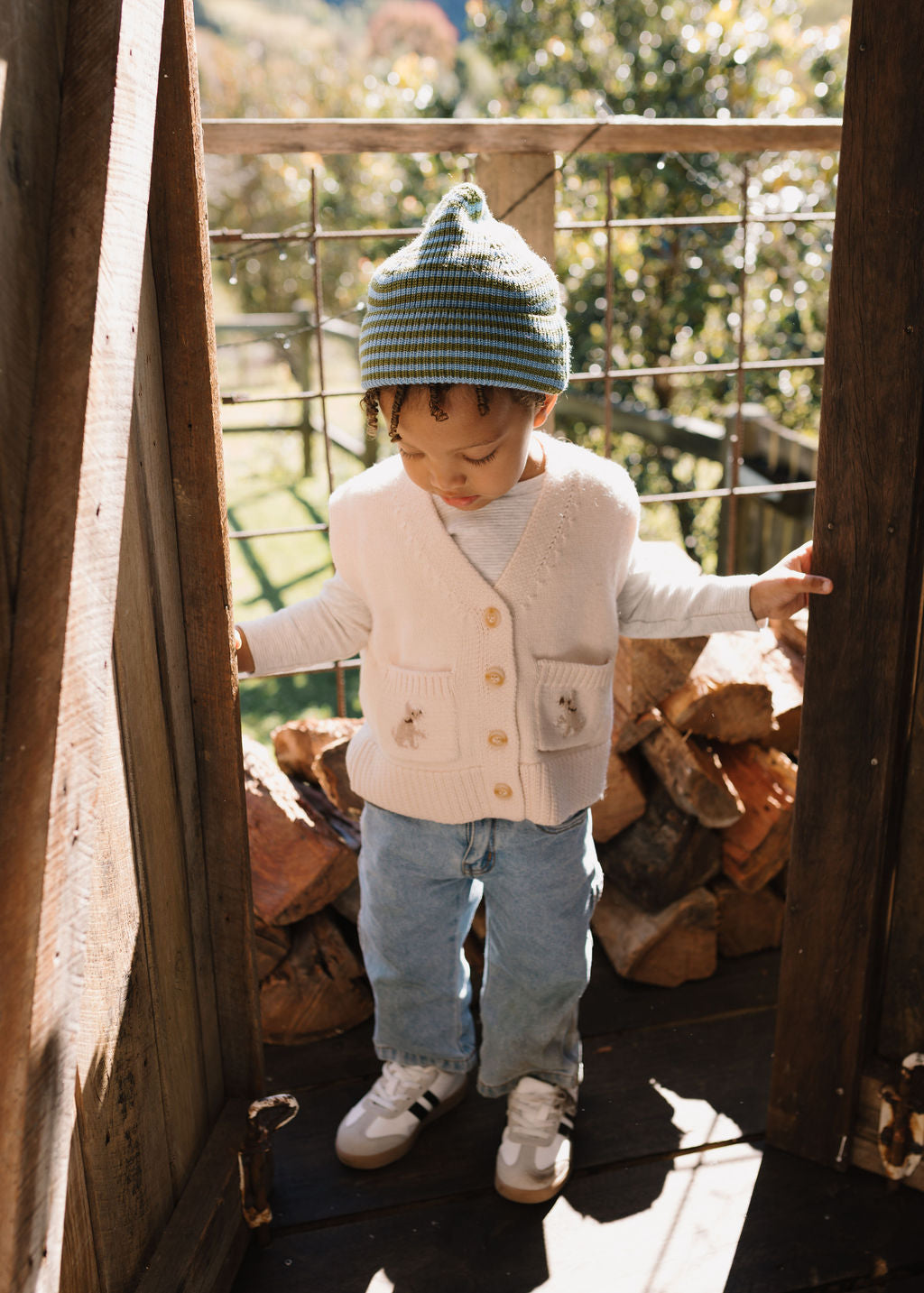 Berlin Merino Beanie Green & Blue Stripe on child top view – kids knitted merino wool striped beanie with pointed top – Acorn Kids