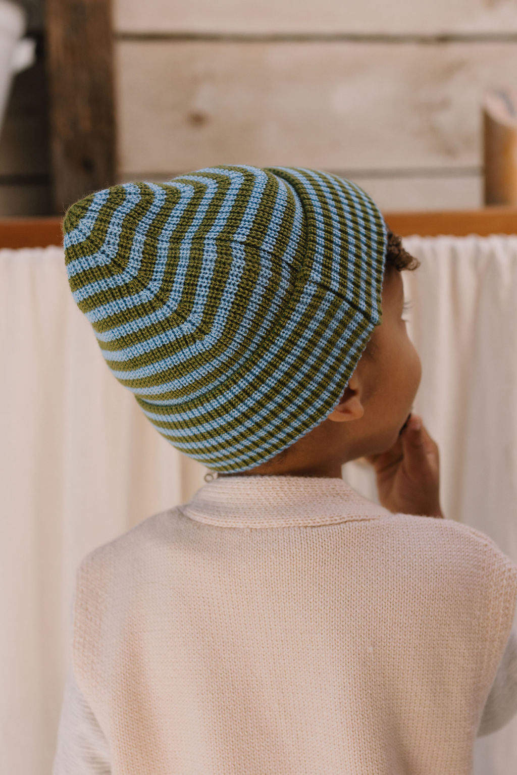 Berlin Merino Beanie Green & Blue Stripe on child back view – kids knitted merino wool striped beanie with pointed top – Acorn Kids