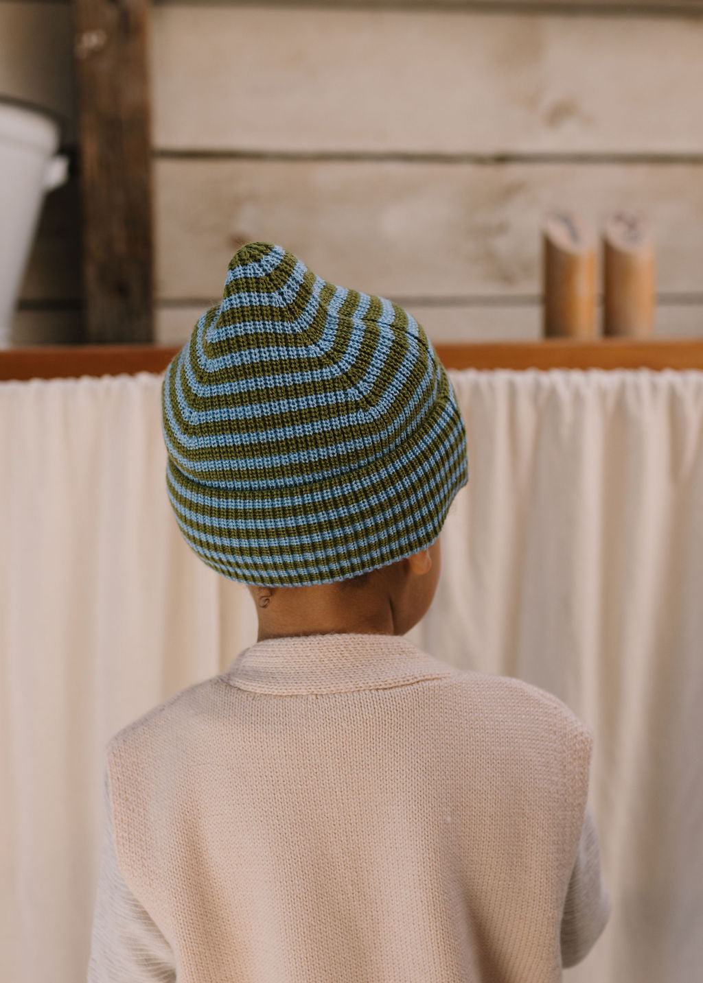 Berlin Merino Beanie Green & Blue Stripe on child back view – kids knitted merino wool striped beanie with pointed top – Acorn Kids