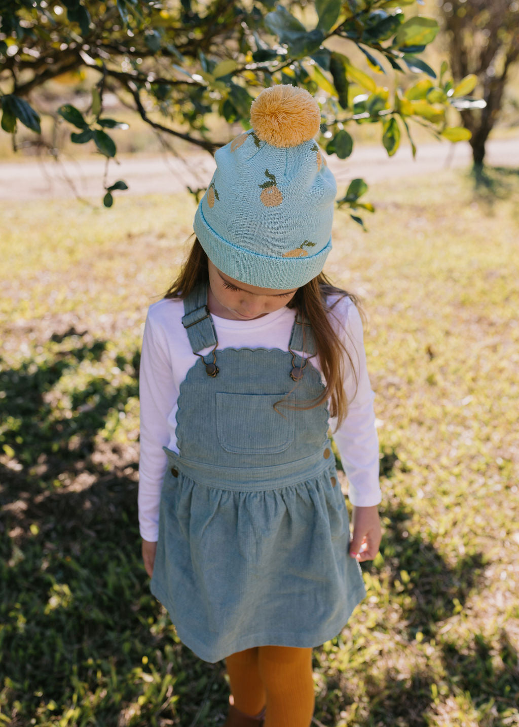Lemon Merino Beanie on child top view – kids knitted merino wool beanie with sweet lemon design – Acorn Kids