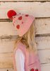 Strawberry Fields Merino Beanie on child side view close up – kids knitted merino wool beanie with strawberry design and pom pom – Acorn Kids