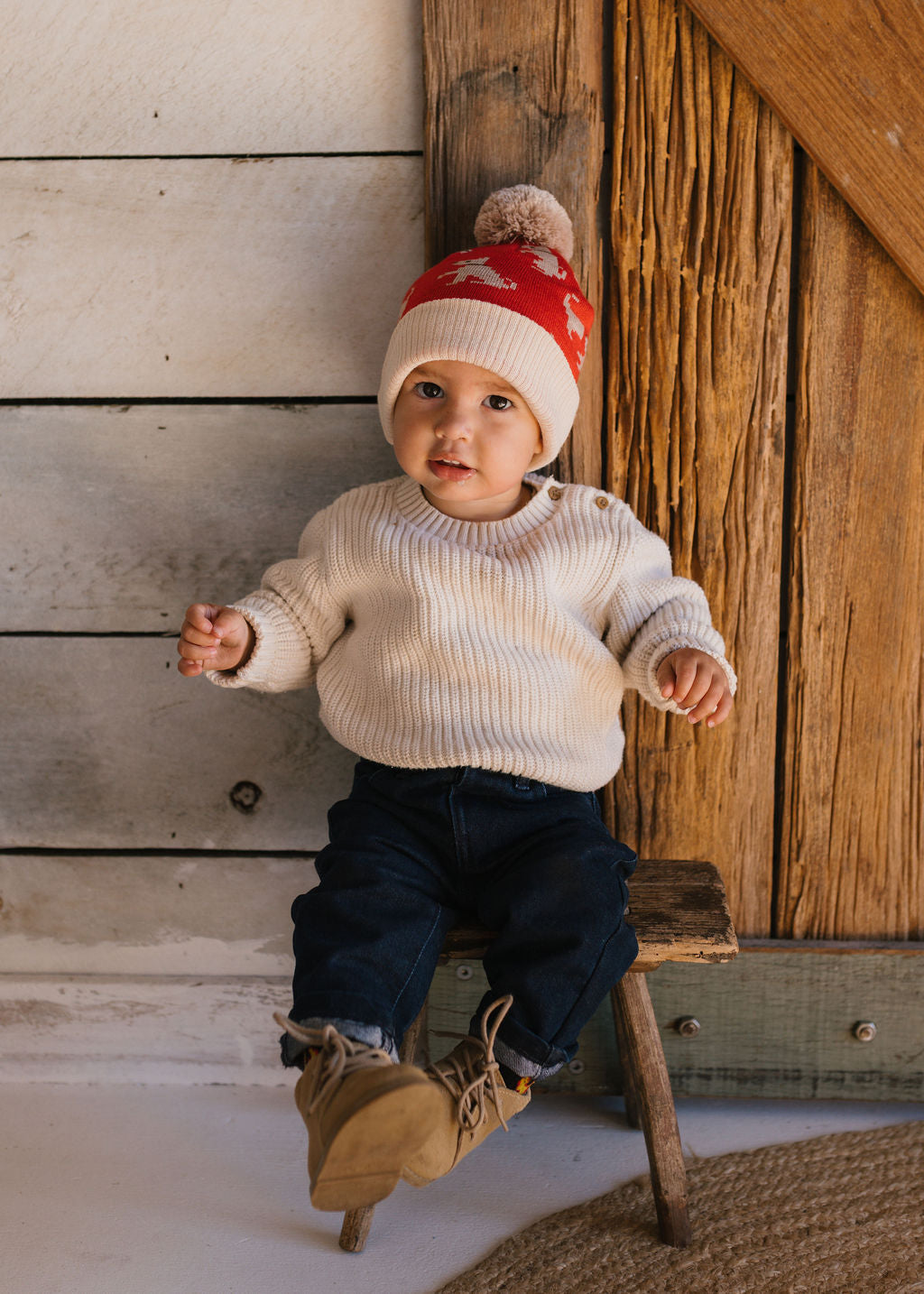 Puppy Dog Merino Beanie on small child front view – kids knitted merino wool beanie with sweet puppy dog design – Acorn Kids