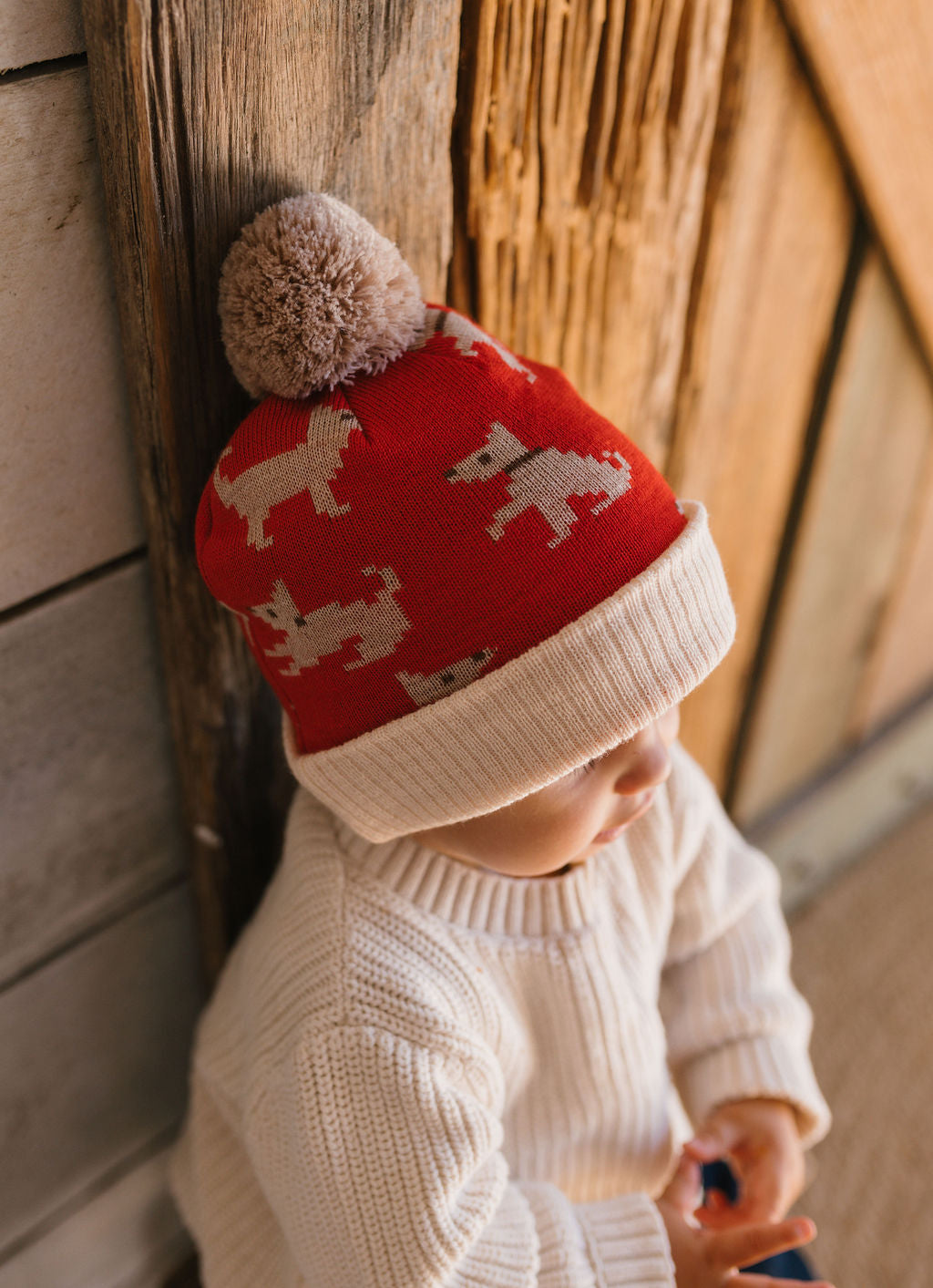 Puppy Dog Merino Beanie on small child side view – kids knitted merino wool beanie with sweet puppy dog design – Acorn Kids