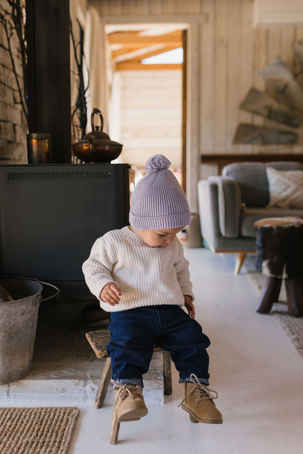 Stargaze Beanie Lavender Speckle – shown on young child - side view - kids cotton beanie with pom pom and speckled yarn design – Acorn Kids
