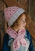 Cherry Beanie – kids hand-knitted pink beanie with crochet cherry and soft wool blend shown on child - side view – Acorn Kids