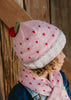 Cherry Beanie – kids hand-knitted pink beanie with crochet cherry and soft wool blend shown on child - side view – Acorn Kids