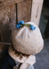 Bluebell Beanie Cream & Blue top view – kids hand-knitted beanie with crochet flower bluebell on top in soft wool blend – Acorn Kids
