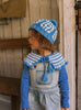 Boho Beanie Blue on child side view – kids hand-crocheted beanie with two-tone granny square pattern and pom pom – Acorn Kids