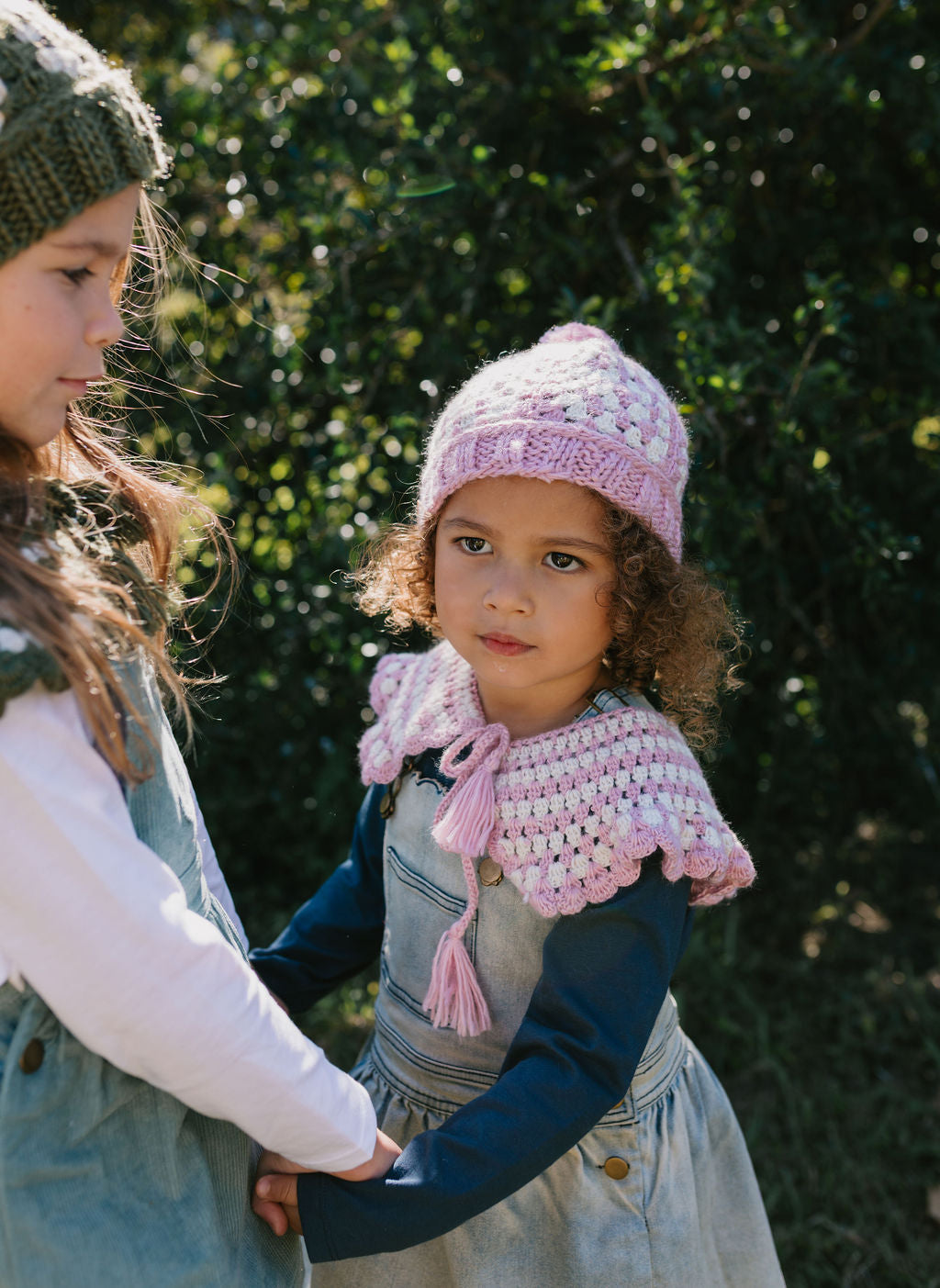 Boho Beanie and Collar Pink on child front view – kids hand-crocheted beanie and scarf with retro stripes and scalloped edge – Acorn Kids