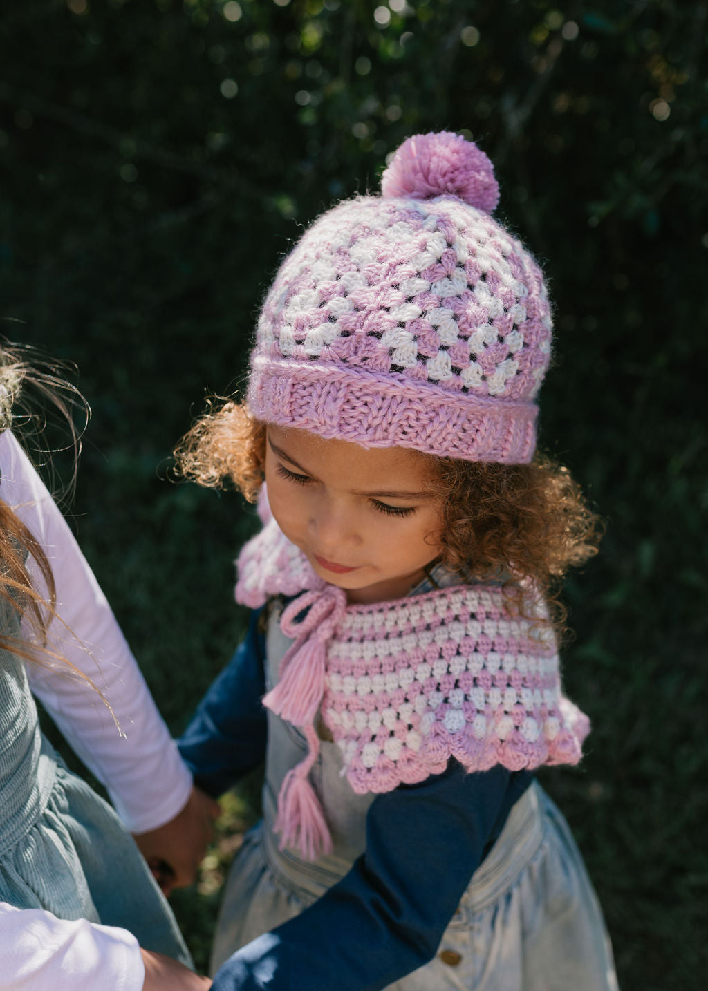 Boho Beanie and Collar Pink on child top view – kids hand-crocheted beanie and collar scarf with retro stripes and scalloped edge – Acorn Kids