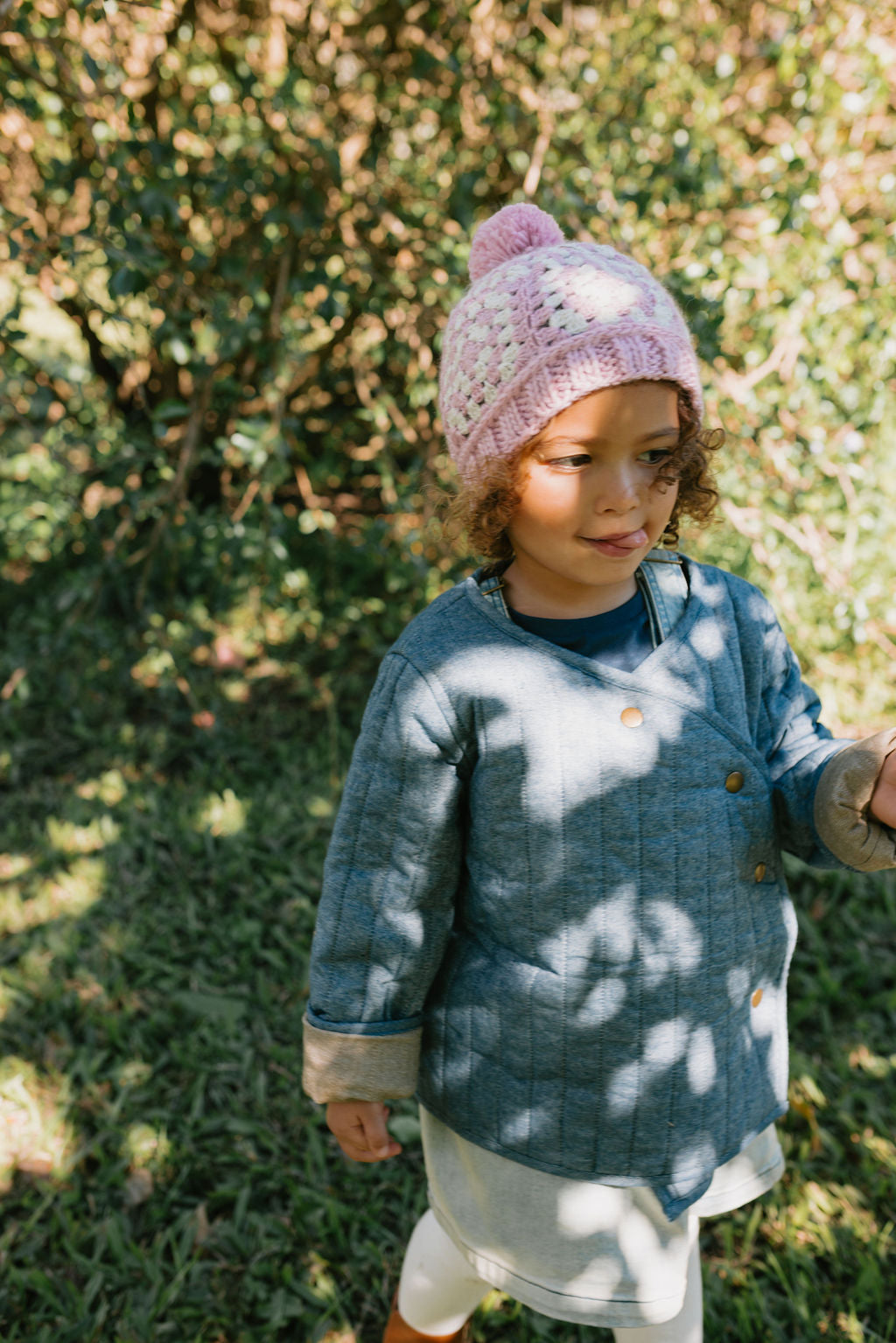 Boho Beanie Pink on child – kids hand-crocheted beanie with two-tone granny square pattern and pom pom – Acorn Kids