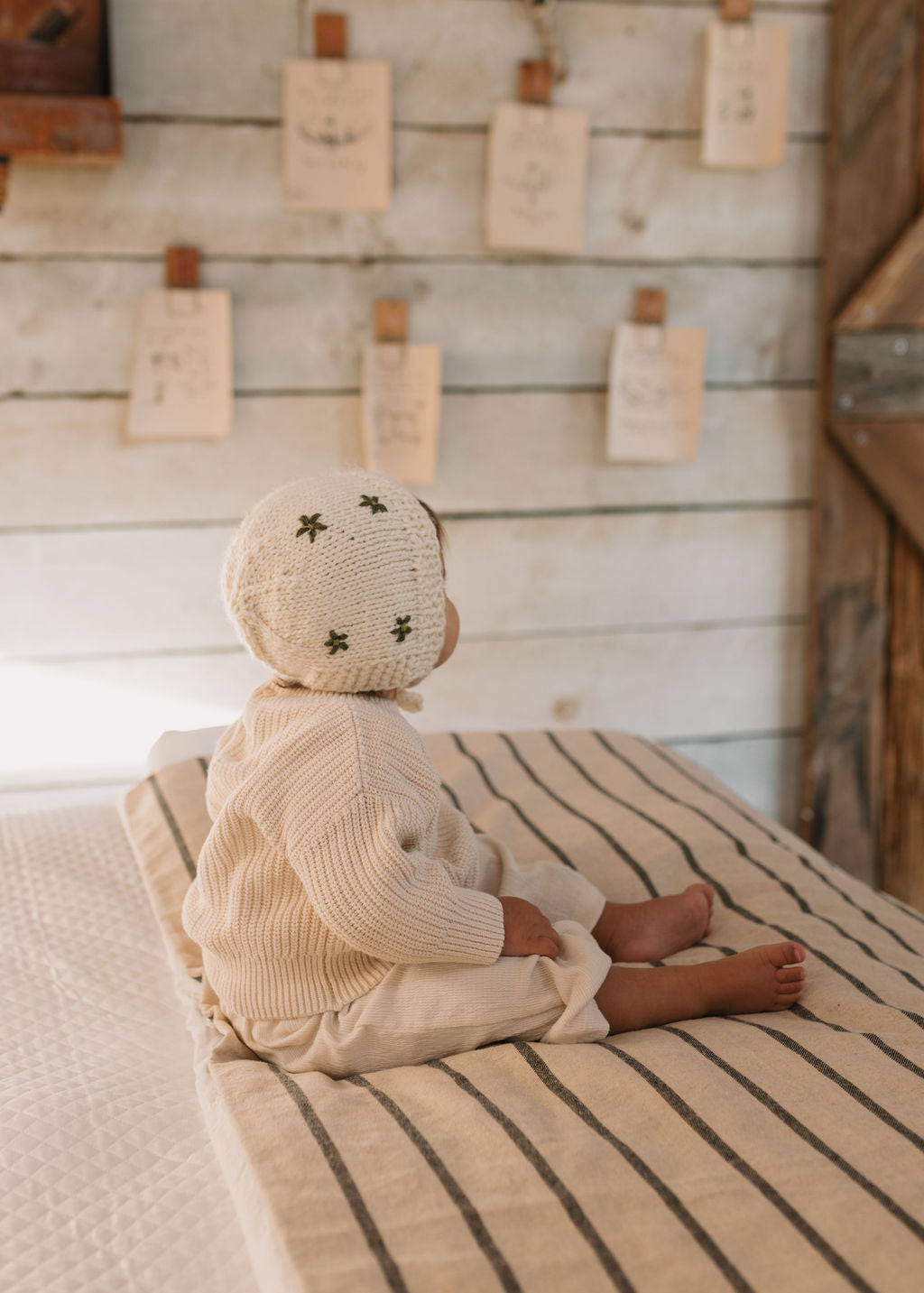 Daisy Bonnet – baby knitted bonnet with daisy flower design in soft wool blend – Acorn Kids