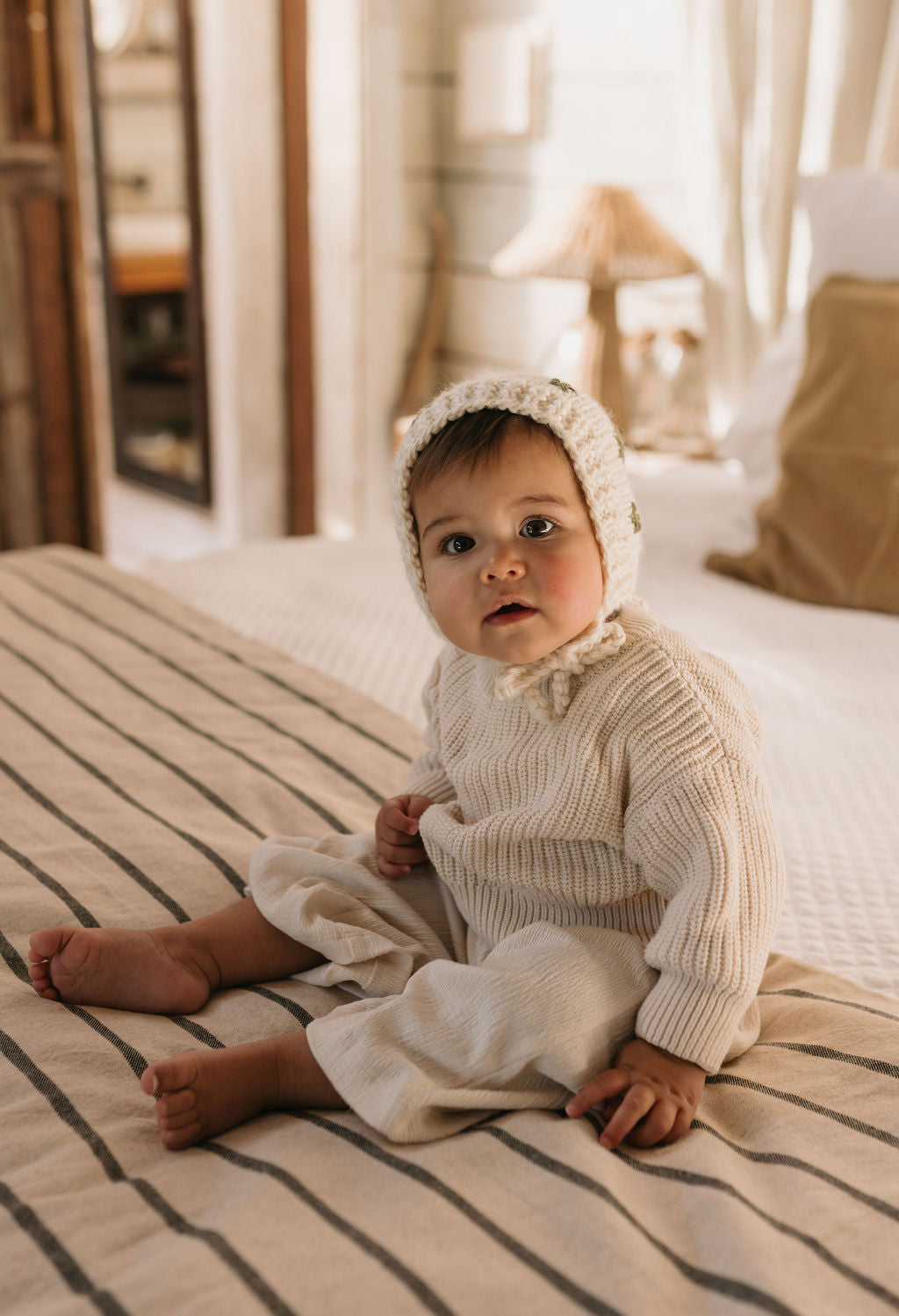 Daisy Bonnet – baby knitted bonnet with daisy flower design in soft wool blend – Acorn Kids