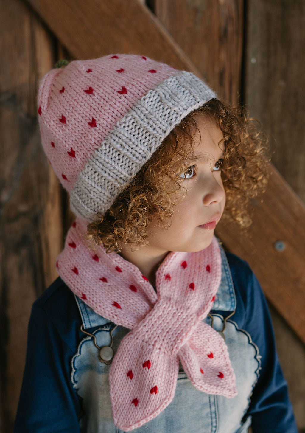 Cherry Cross Over Scarf – side view - kids hand-knitted cross over scarf in pink and red wool blend – Acorn Kids