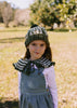 Boho Beanie and Collar Khaki on child front view – kids hand-crocheted beanie and scarf with retro stripes and scalloped edge – Acorn Kids