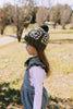 Boho Beanie and Collar Khaki on child side view – kids hand-crocheted beanie and scarf with retro stripes and scalloped edge – Acorn Kids