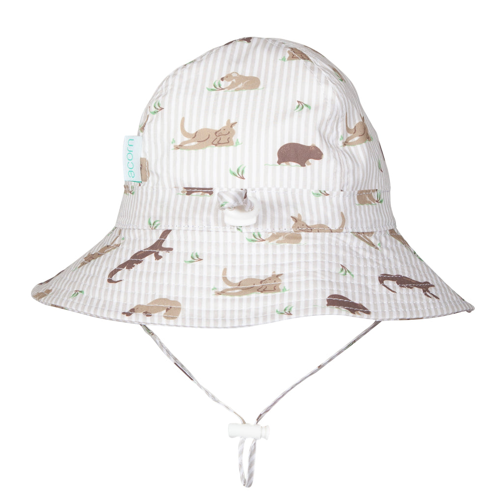 A white striped bucket hat with a playful print of kangaroos, koalas, and other marsupials in brown and beige, featuring a white chin strap.